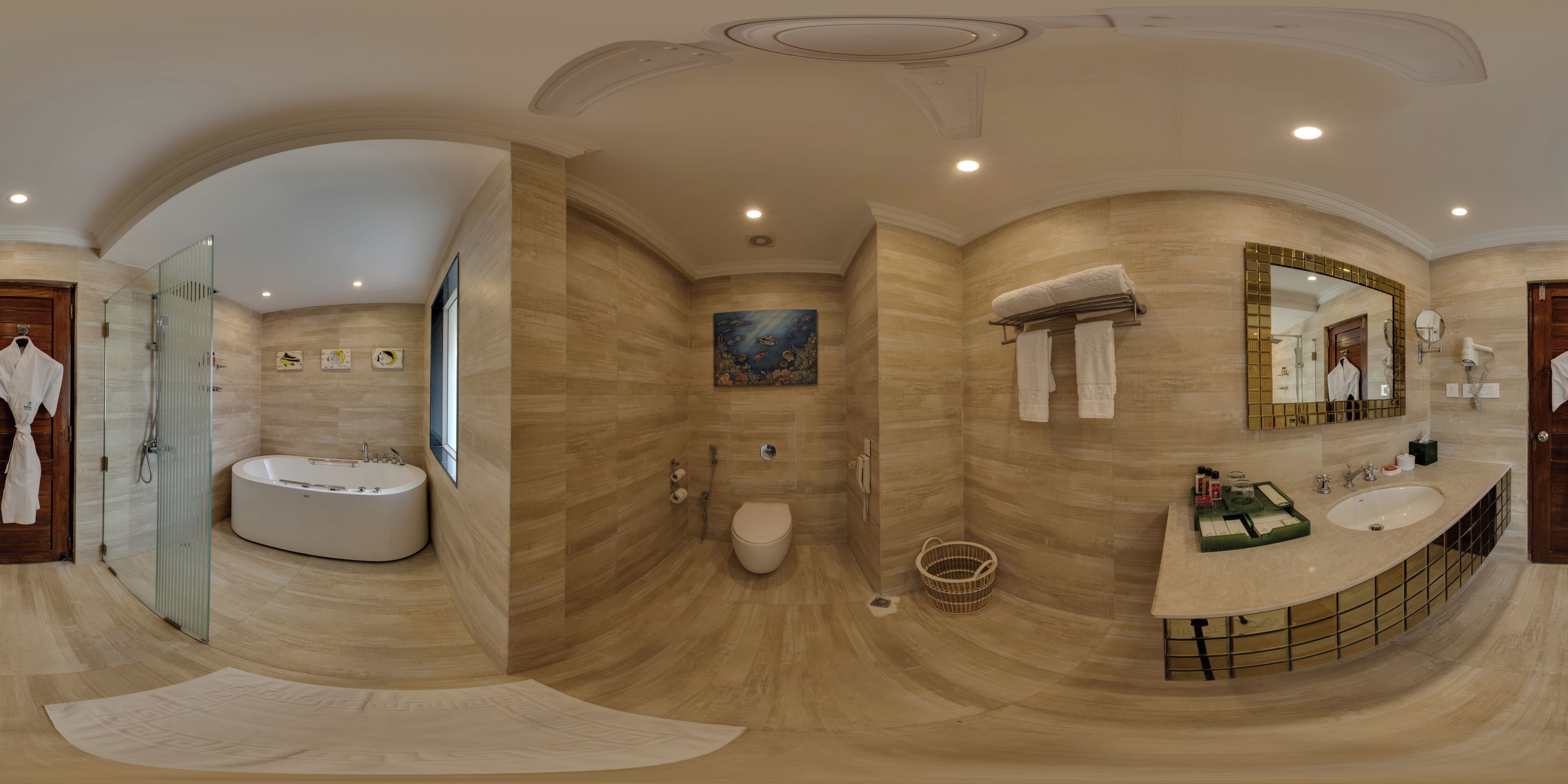 A panoramic view of a modern bathroom with a freestanding bathtub, a toilet, a sink, and a shower area.