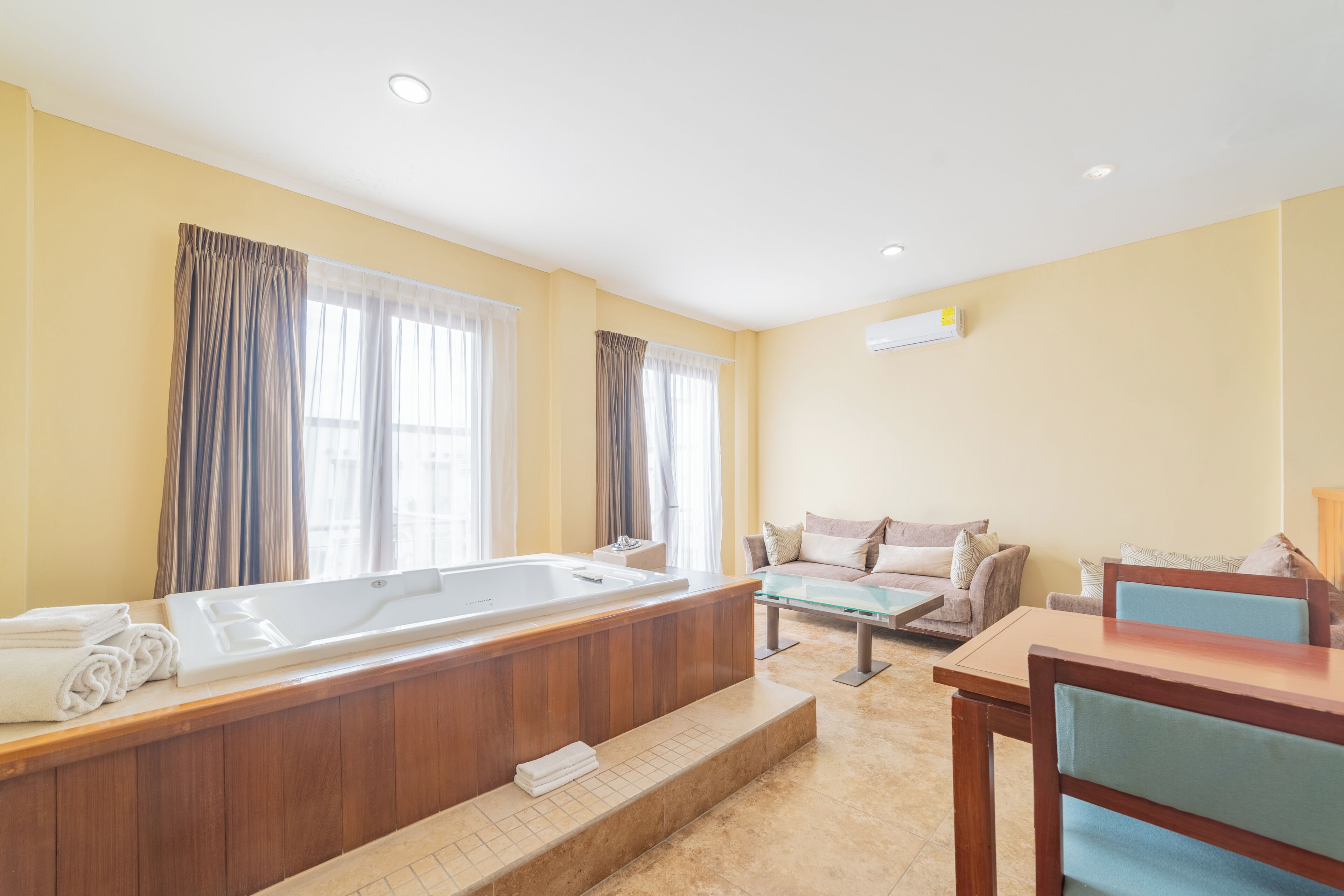 master suite honeymoon | living area | flat-screen tv