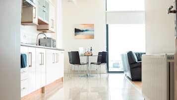 Standard Apartment, 2 Bedrooms | Living area | 40-inch TV with cable channels