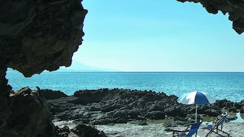 Private beach, beach umbrellas, beach towels