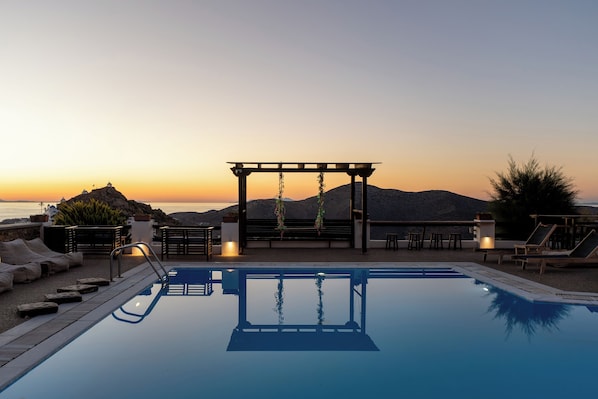 Seasonal outdoor pool, open 9 AM to 10 PM, pool umbrellas, sun loungers