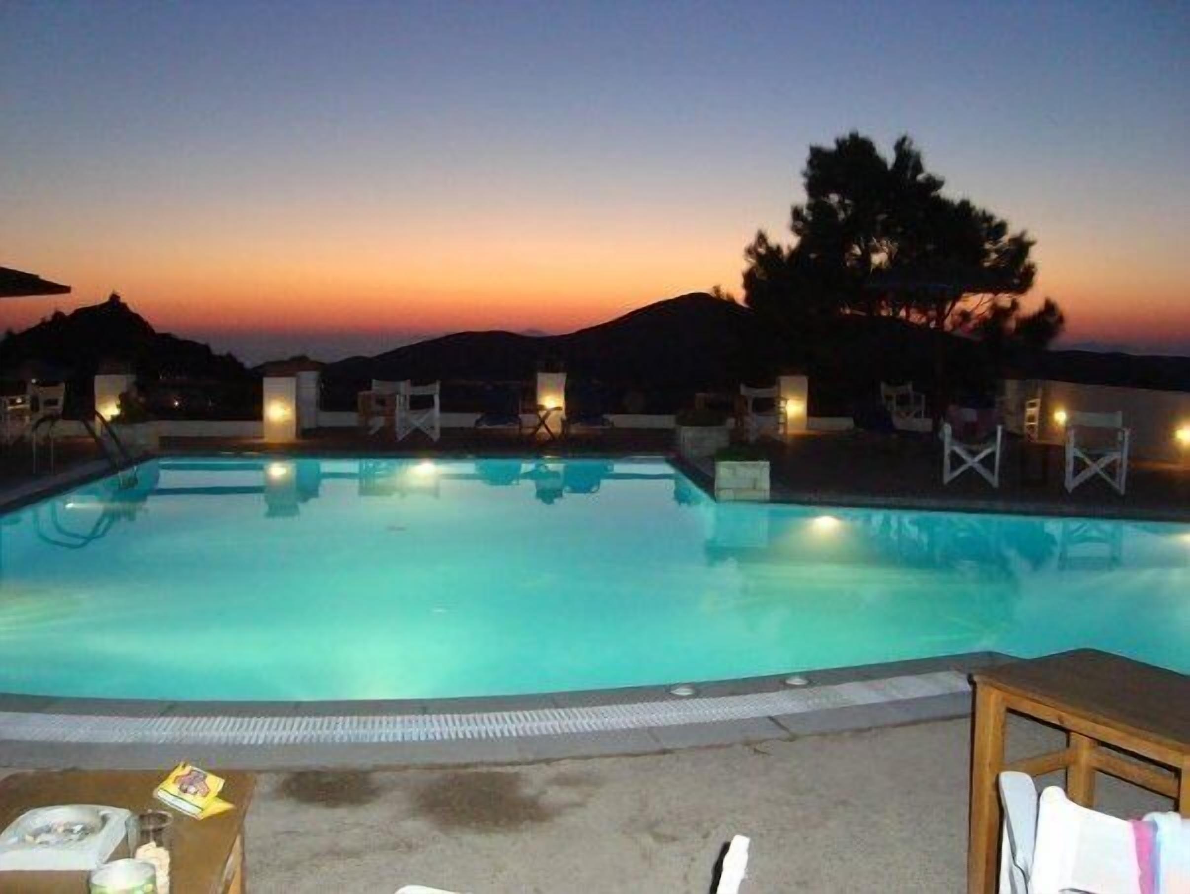 Seasonal outdoor pool, open 9 AM to 10 PM, pool umbrellas, sun loungers