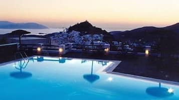 Seasonal outdoor pool, open 9 AM to 10 PM, pool umbrellas, sun loungers