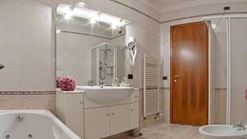 Shower, free toiletries, hair dryer, slippers
