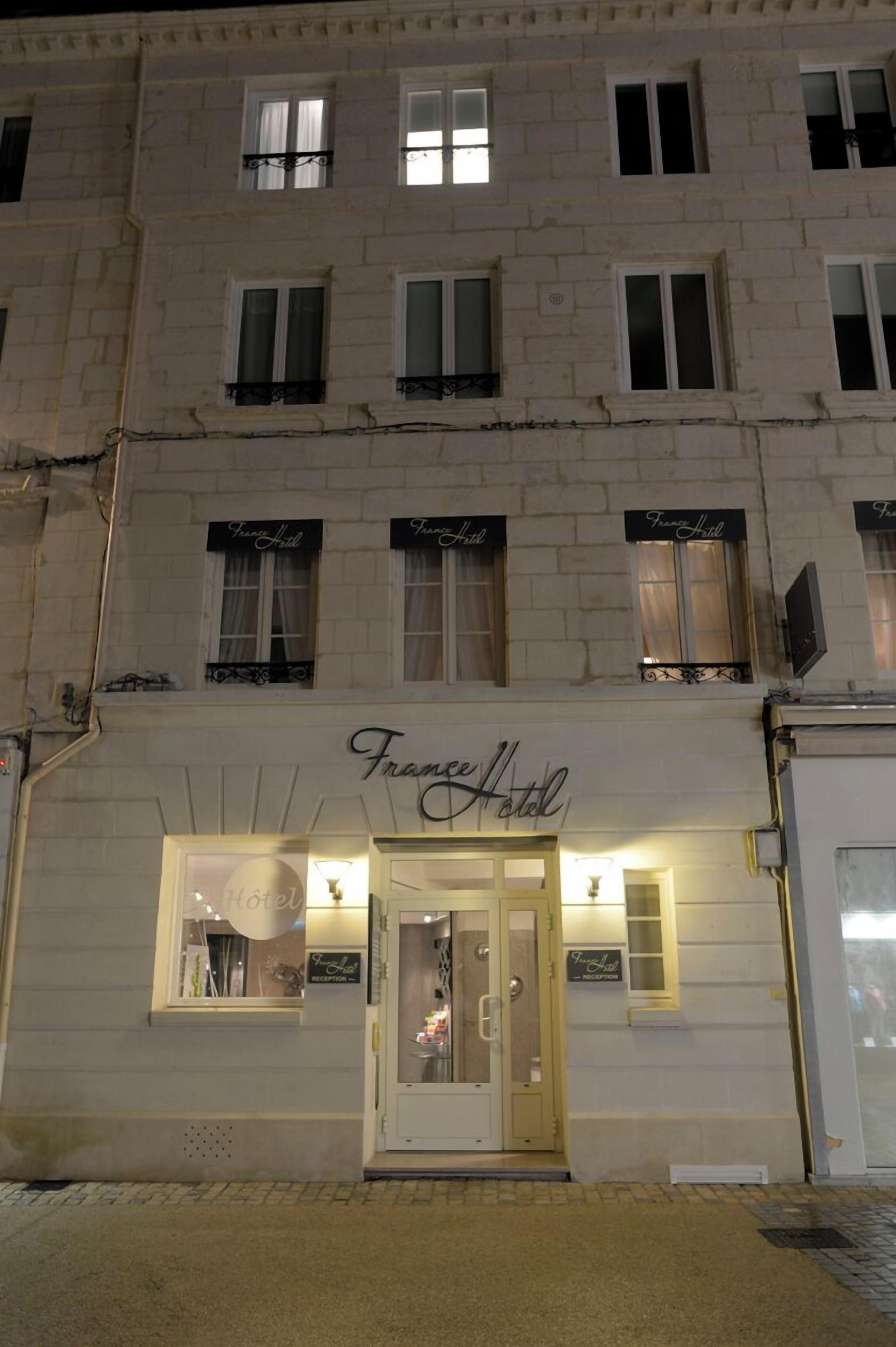 A hotel facade with multiple windows and a sign reading "Franz Hotel".