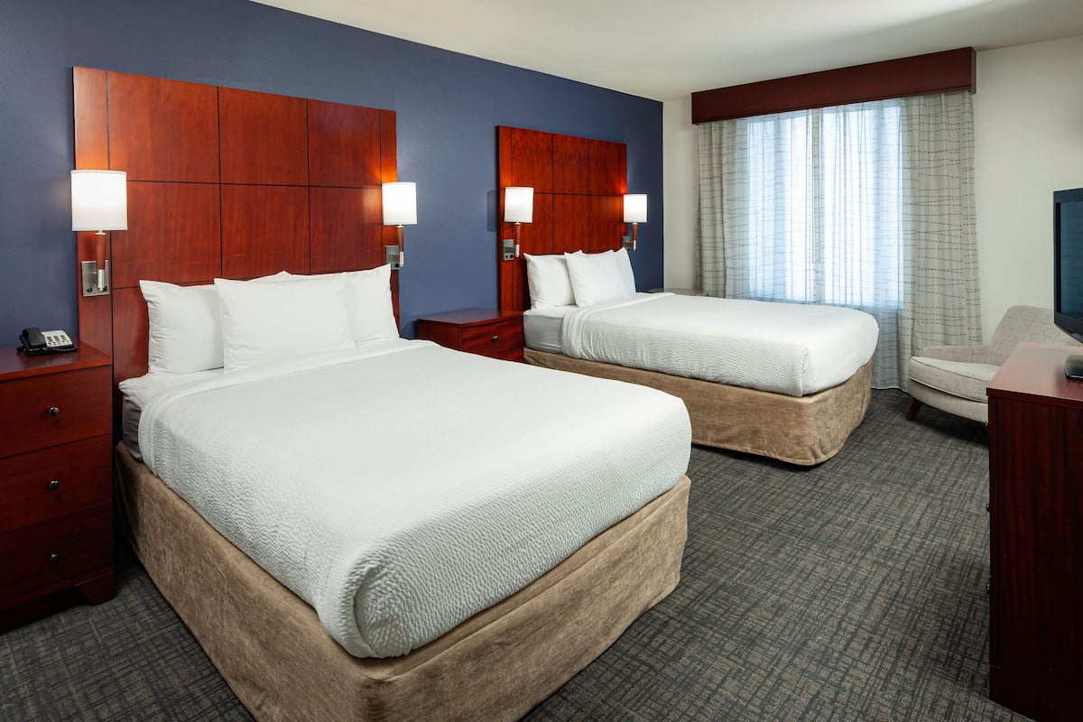 Premium bedding, desk, laptop workspace, iron/ironing board
