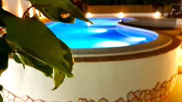 Seasonal outdoor pool, open 9:30 AM to 7:00 PM, pool loungers