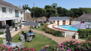 A residential property with a swimming pool, outdoor seating, and a garden. - La Barbarie Hotel by Eight Continents (St. Martins)