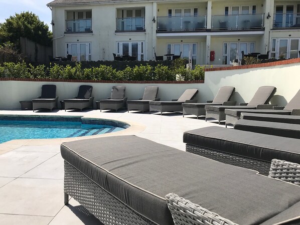 Outdoor pool, pool umbrellas, pool loungers