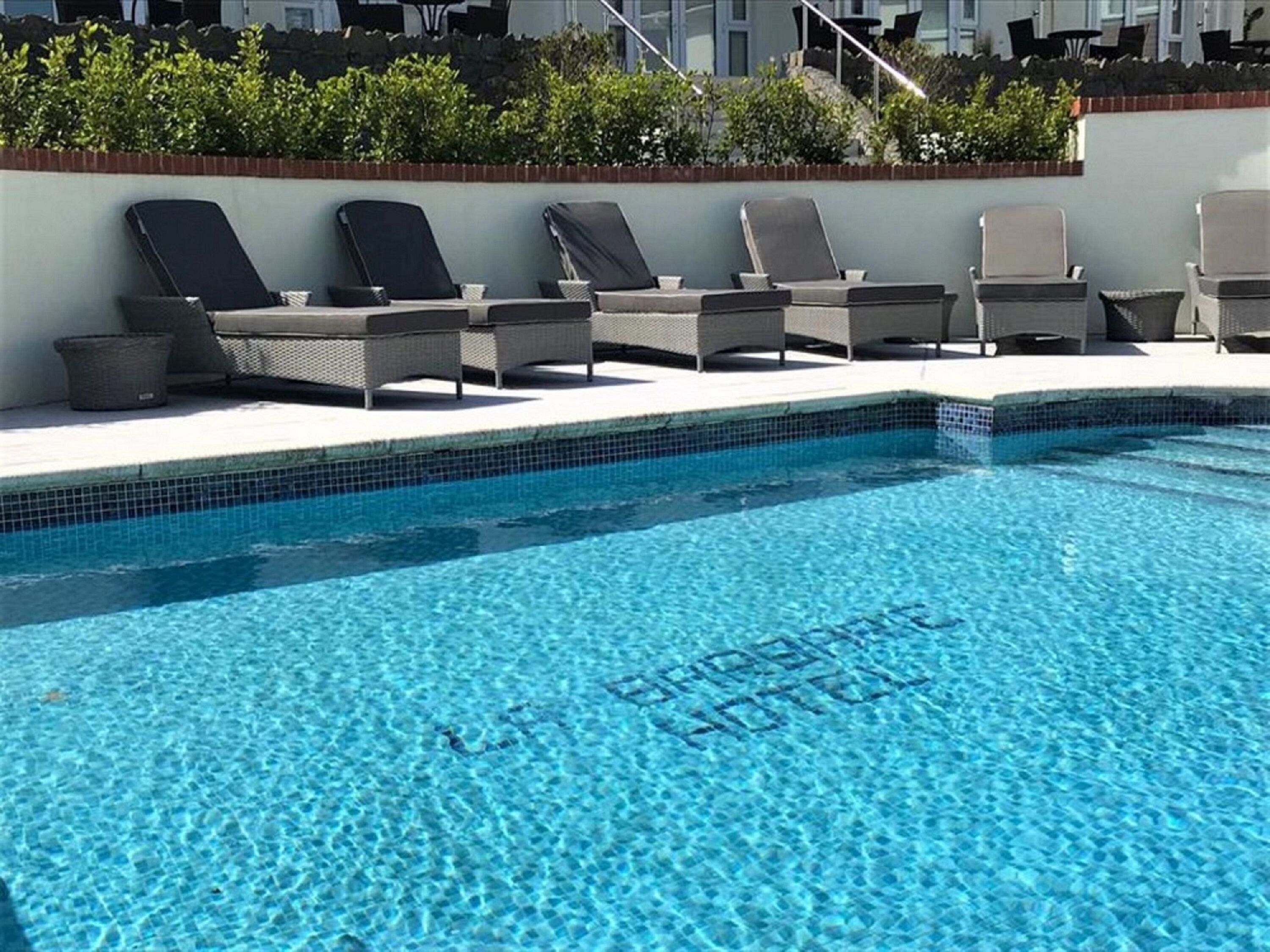 outdoor pool, pool umbrellas, pool loungers