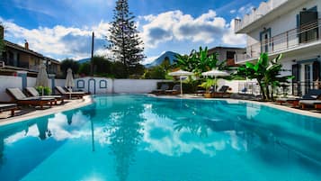 Seasonal outdoor pool, open 9 AM to 7 PM, pool umbrellas, sun loungers