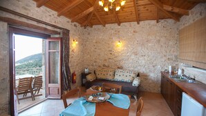 Deluxe Apartment, Panoramic Sea View | Living room | TV - Anigraia (North Kynouria)