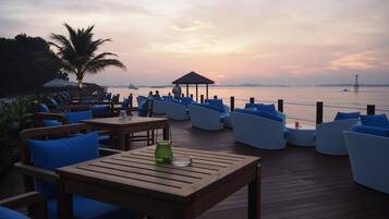 Relax on the deck overlooking the calm waters.