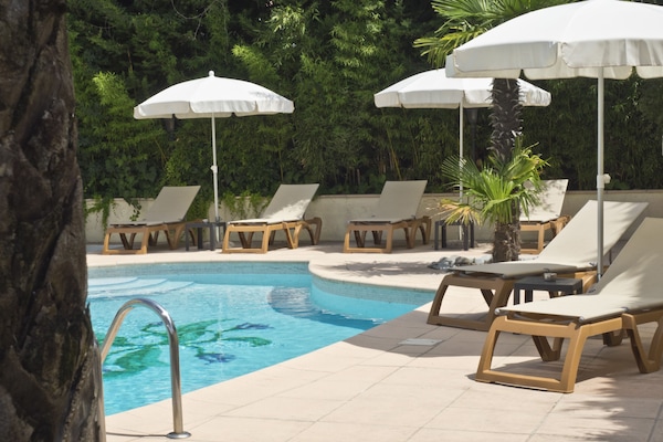 Seasonal outdoor pool, open 7:30 AM to 8:00 PM, sun loungers
