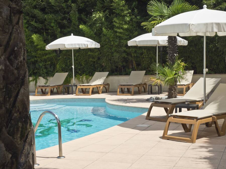 Seasonal outdoor pool, open 7:30 AM to 8:00 PM, pool loungers