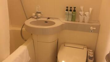 Combined shower/tub, free toiletries, hair dryer, slippers
