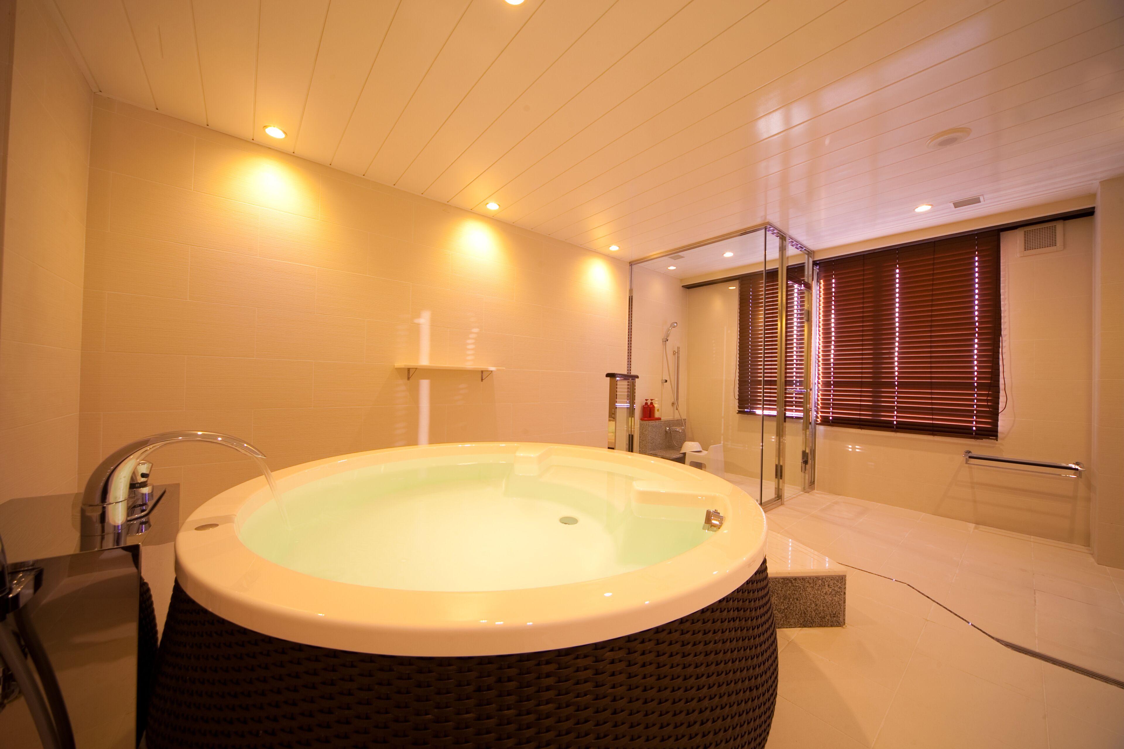 A modern bathroom with a freestanding bathtub, a glass shower enclosure, and a walk-in shower.