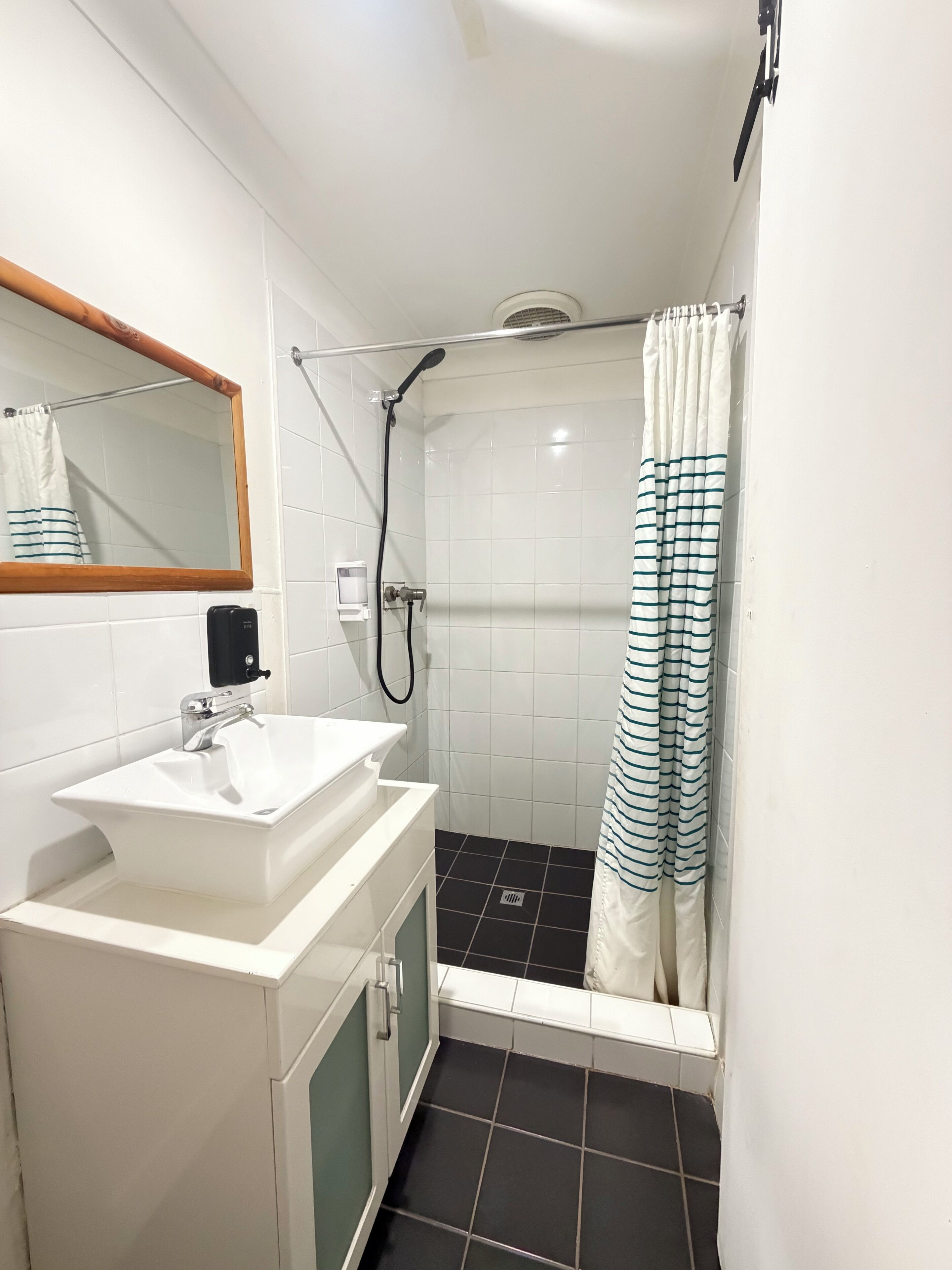 Shower, rainfall showerhead, hair dryer, towels