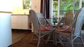 Deluxe Cottage, 2 Bedrooms, Garden View, Poolside | Living area | 40-inch Smart TV with satellite channels, TV, Netflix