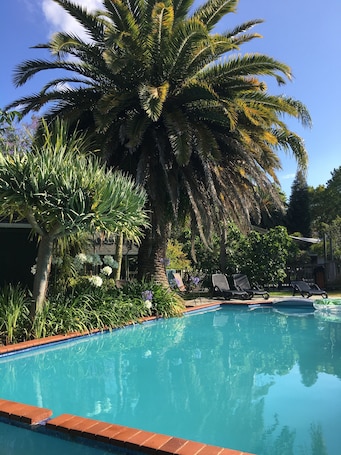 Outdoor pool, open 8:00 AM to 10:00 PM, pool umbrellas, pool loungers