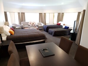 Family Studio, 1 King Bed | Premium bedding, minibar, in-room safe, individually decorated
