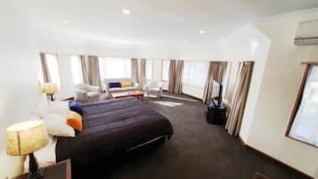 Family Studio, 1 King Bed | Premium bedding, minibar, in-room safe, individually decorated