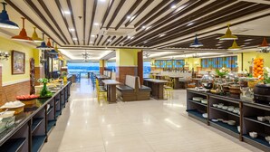 A spacious buffet area with multiple seating options and a variety of food displays. - Sunlight Guest Hotel (Puerto Princesa)