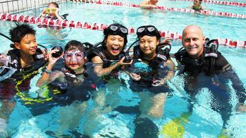 Guests can enjoy a refreshing swim in the pool, marked with lane dividers for lap swimming.