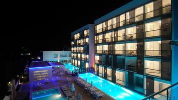 Indoor pool, outdoor pool, pool umbrellas, sun loungers