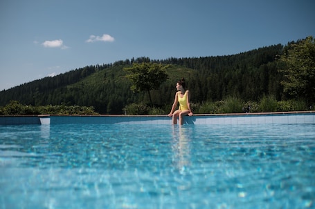 2 indoor pools, outdoor pool, open 6 AM to 8 PM, pool umbrellas