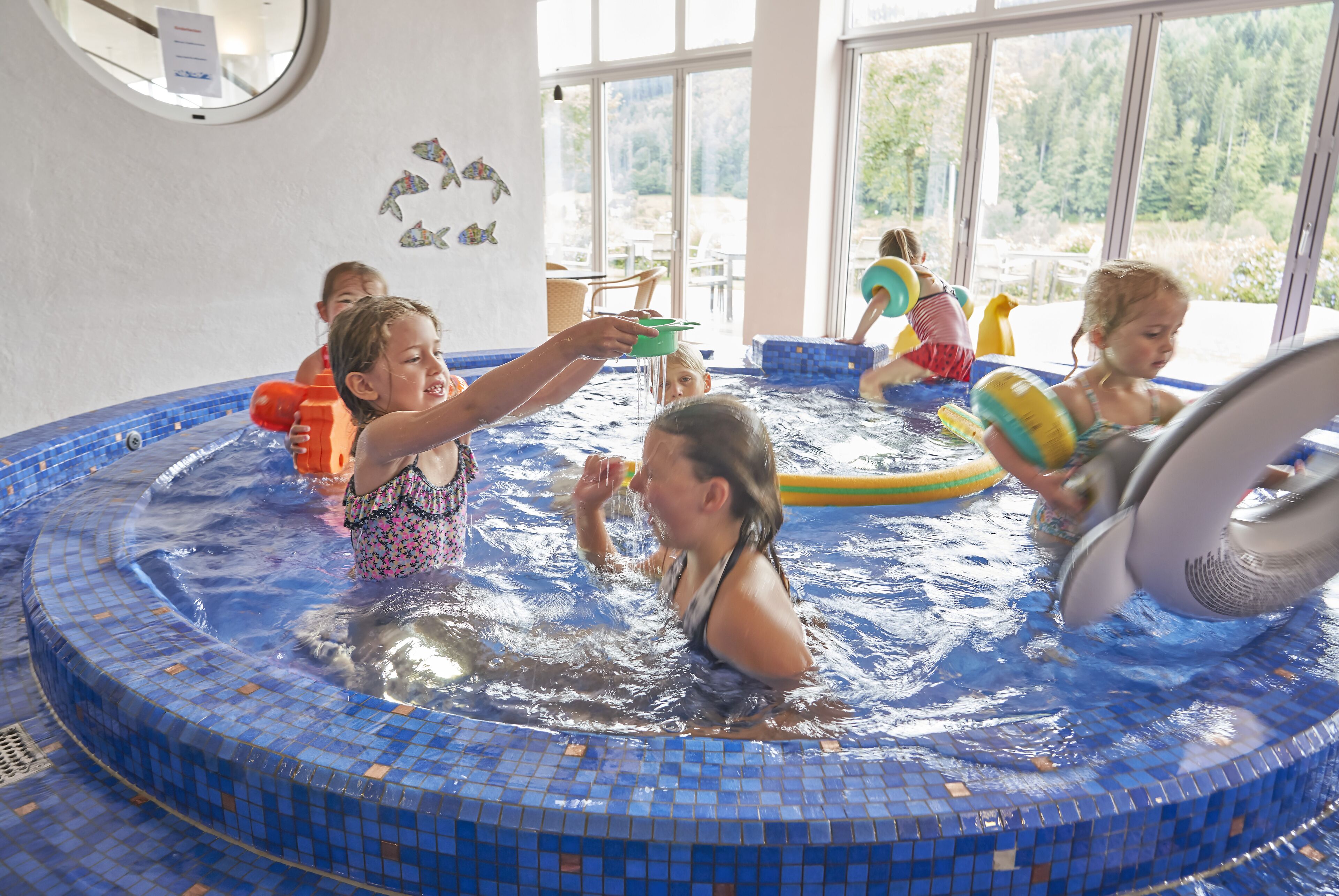 2 indoor pools, outdoor pool, open 6 am to 8 pm, pool umbrellas