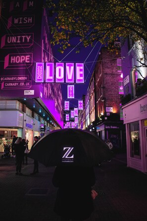 A street scene with illuminated signs including "LOVE" and "CARNABY.CO.UK". - The Z Hotel Soho (London)
