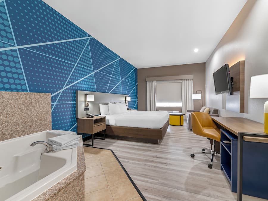 Room, 1 King Bed, Jetted Tub | Premium bedding, desk, iron/ironing board, rollaway beds