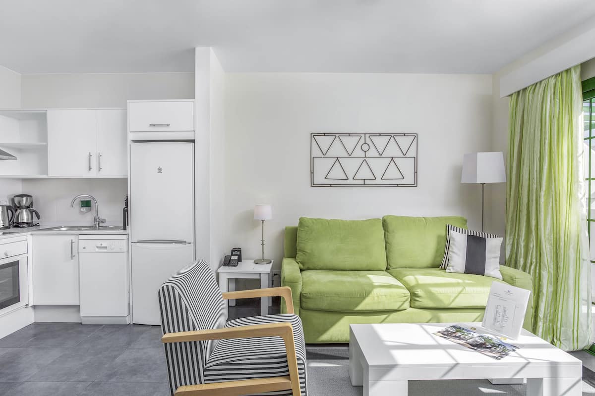 apartment, 1 bedroom | living area | 28-inch flat-screen tv with digital channels, tv