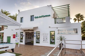 A modern building with a sign reading "Club del Carmen". - Club Del Carmen (Tías)