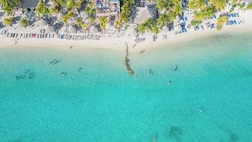 Beach nearby, white sand, sun loungers, beach towels