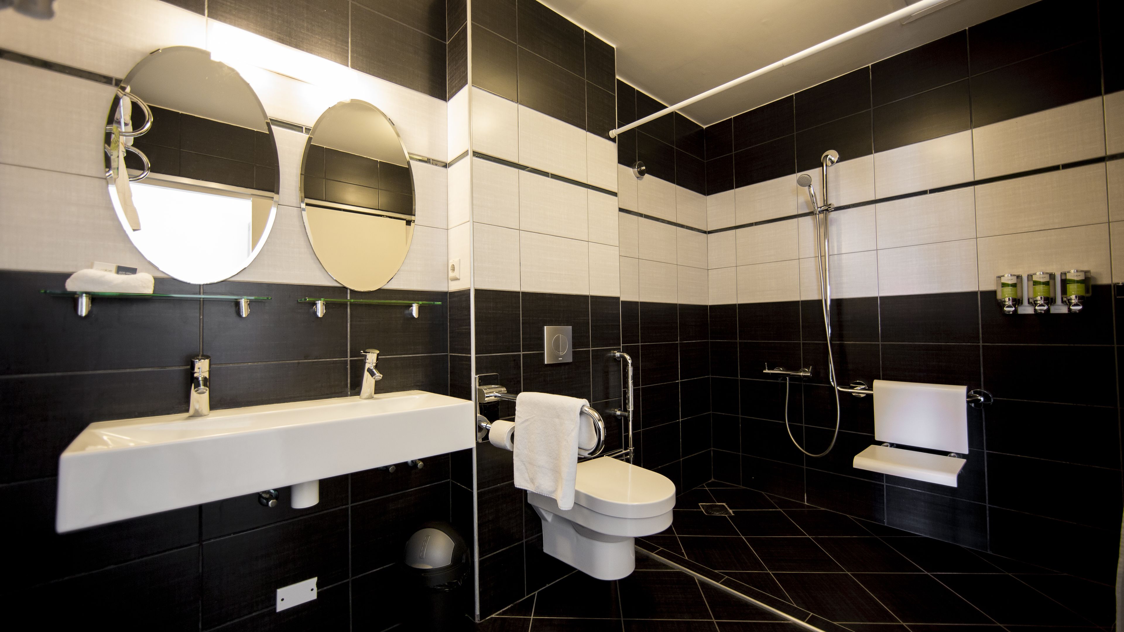 deluxe studio | bathroom | shower, designer toiletries, towels
