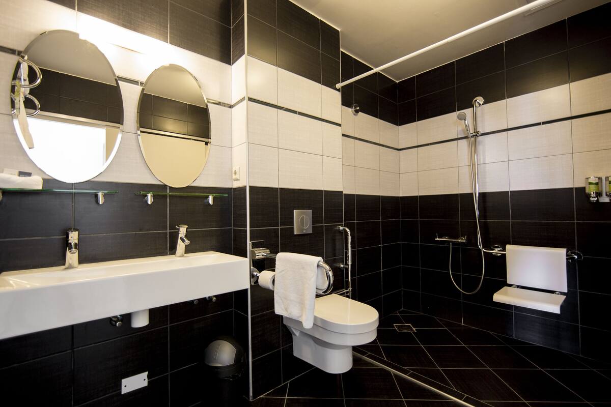 deluxe studio | bathroom | shower, designer toiletries, towels