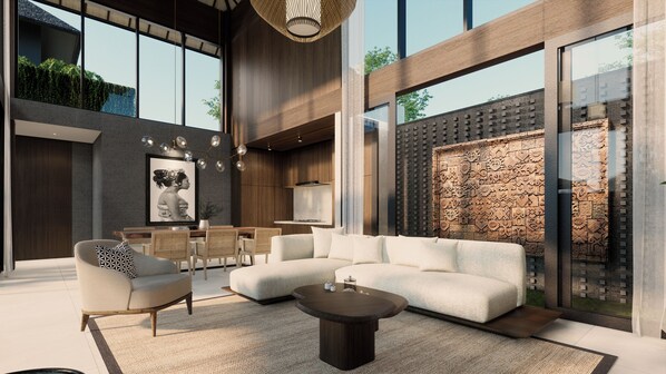 A modern living room with a sectional sofa, a coffee table, and a dining area with wicker chairs. - The One Boutique Villa & Spa Seminyak (Seminyak)