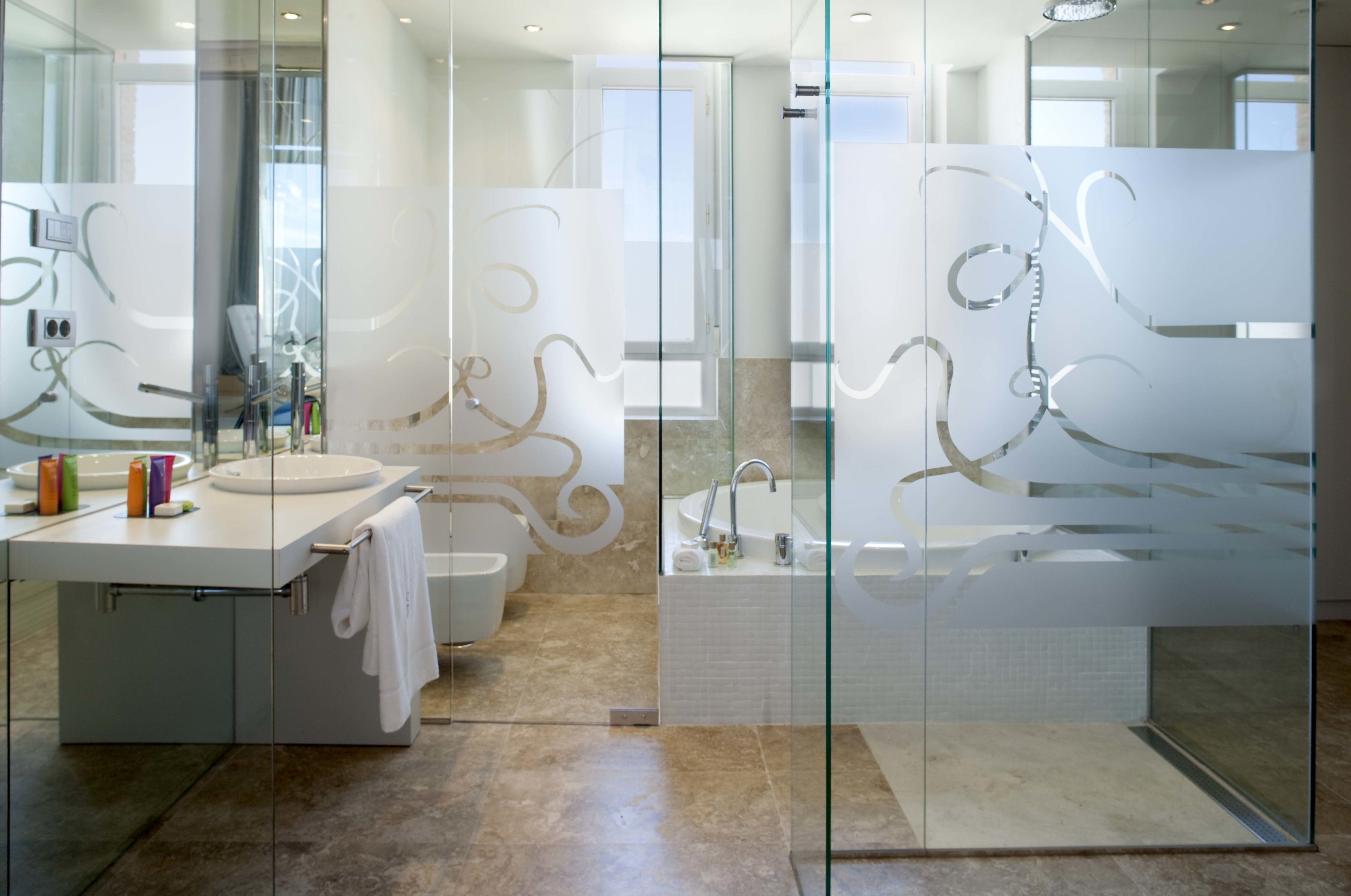 deluxe room, 1 queen bed | bathroom | free toiletries, bidet, towels