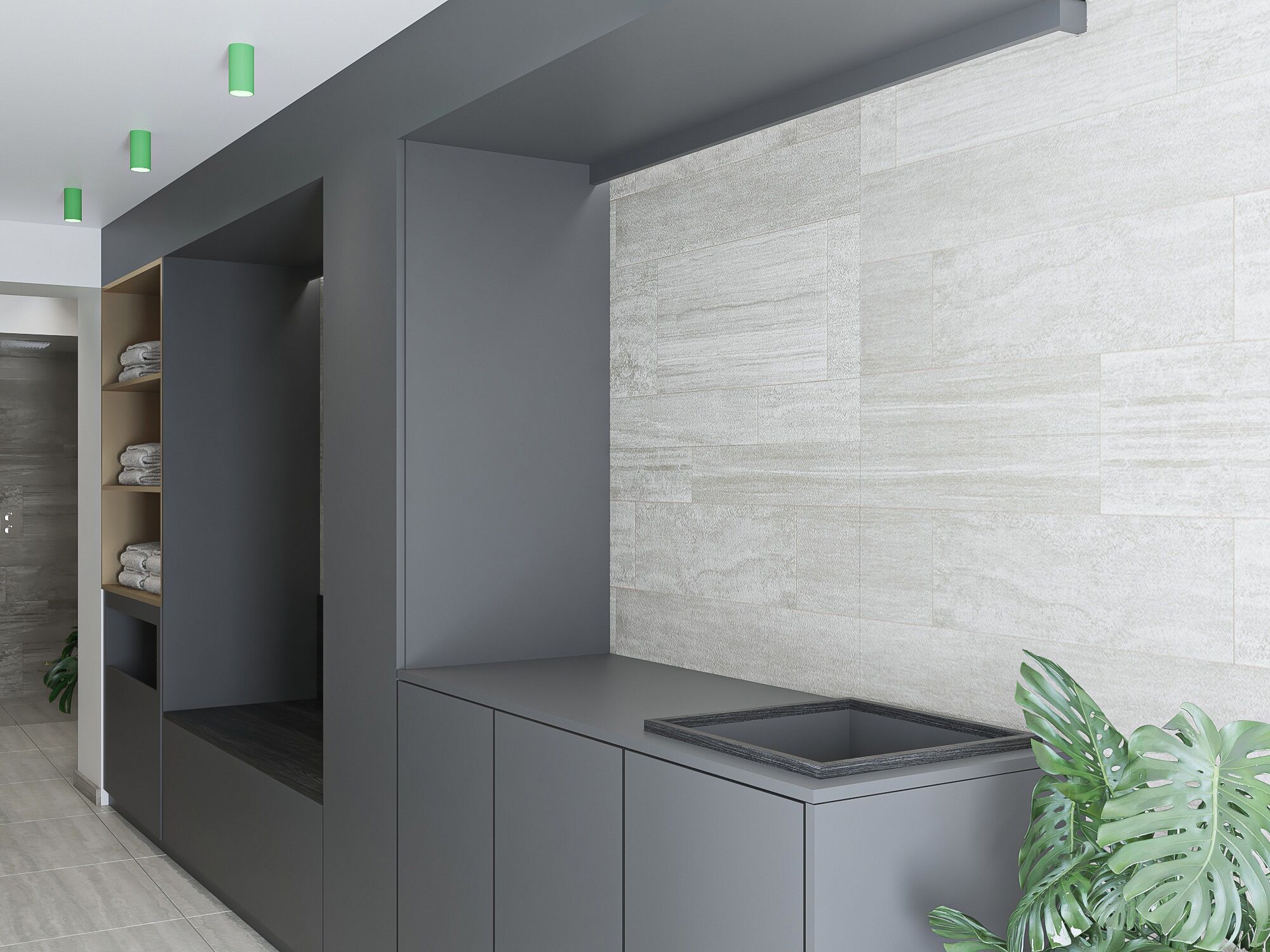 A modern bathroom with a grey cabinet, a sink with a textured countertop, and a green plant.