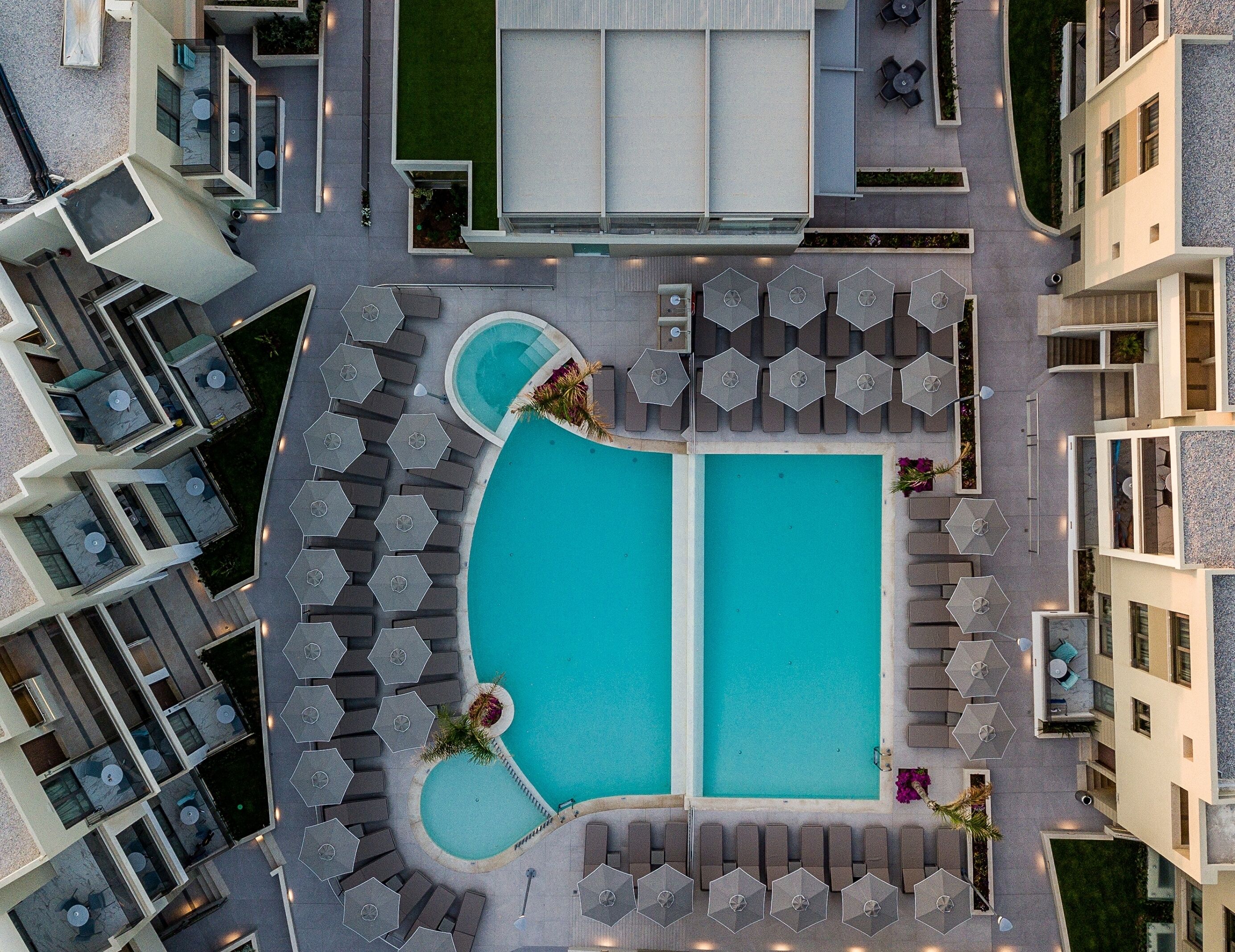 Outdoor pool, open 8:00 AM to 8:00 PM, pool umbrellas, pool loungers
