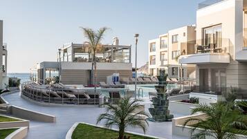 Outdoor pool, open 8:00 AM to 8:00 PM, pool umbrellas, sun loungers