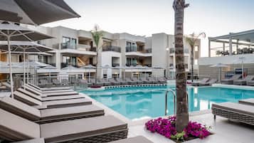 Outdoor pool, open 8:00 AM to 8:00 PM, pool umbrellas, sun loungers