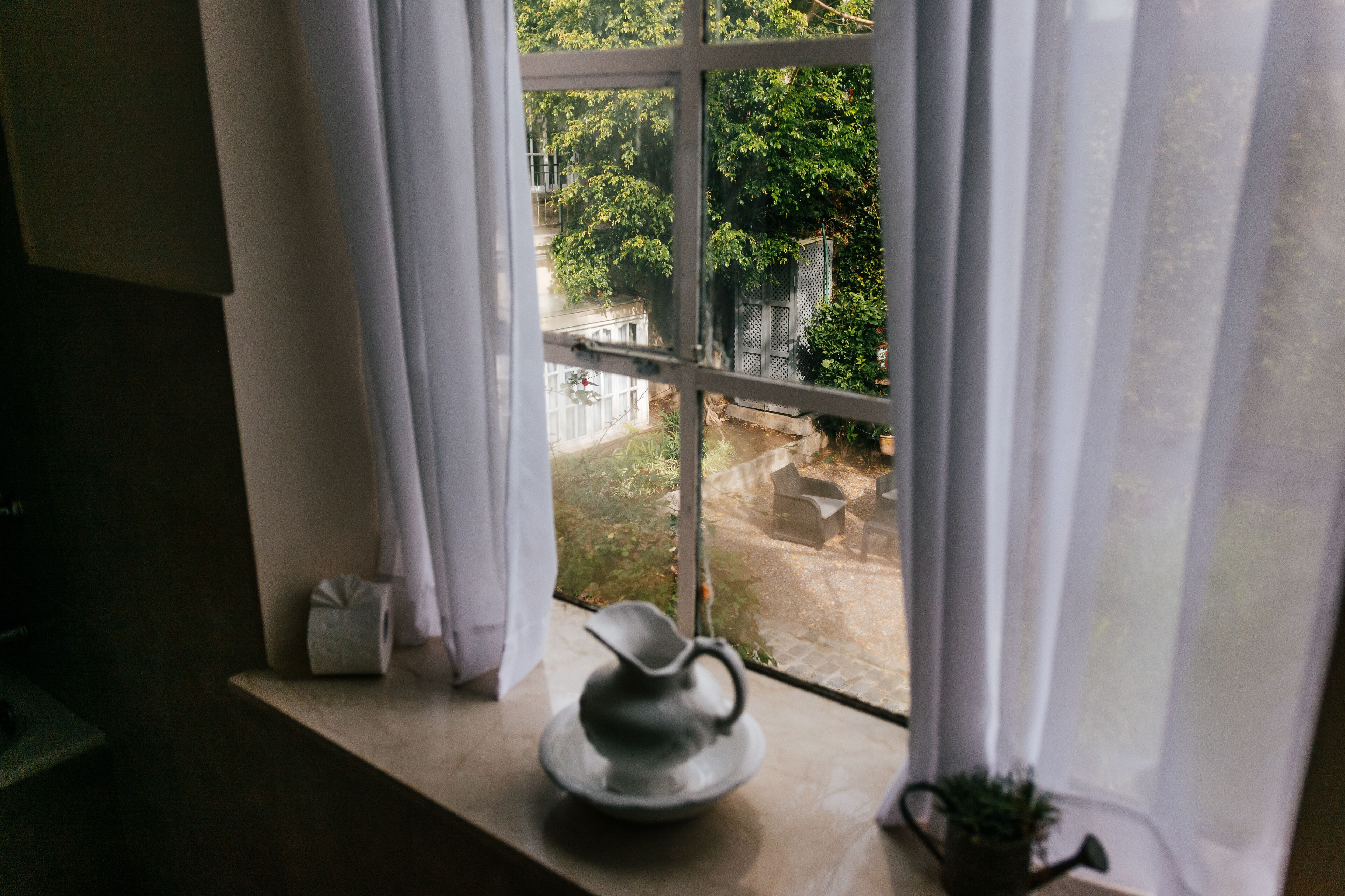 suite, garden view | bathroom | combined shower/bathtub, deep-soaking bathtub, rainfall showerhead