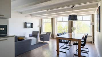 Large 1 Bedroom Apartment with Sofa Bed | Living area | 32-inch flat-screen TV with cable channels, TV