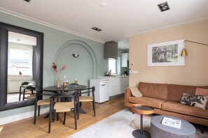 Large 1 Bedroom Apartment | Living area | 43-inch Smart TV with satellite channels