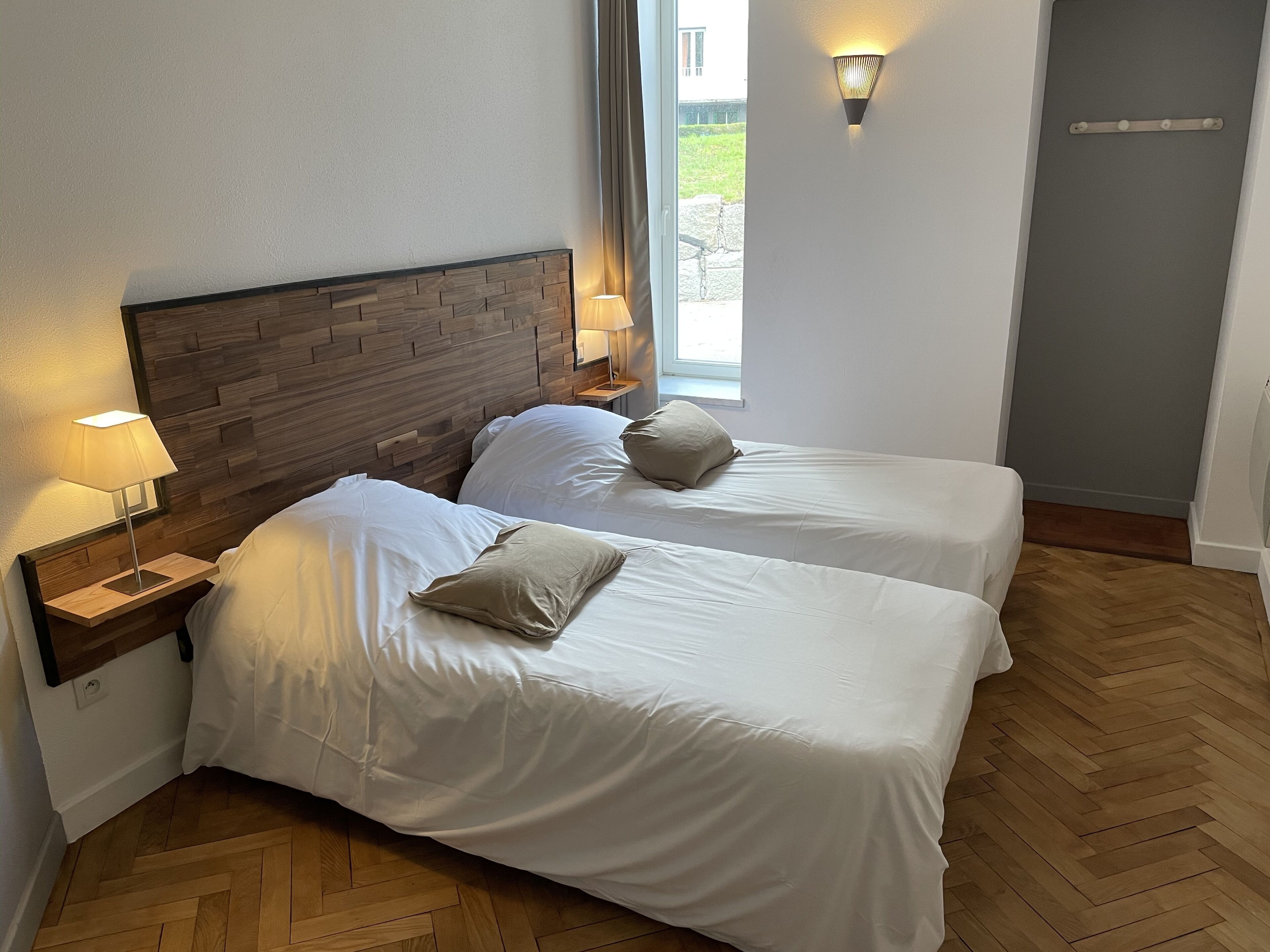 Premium bedding, pillow-top beds, desk, blackout curtains