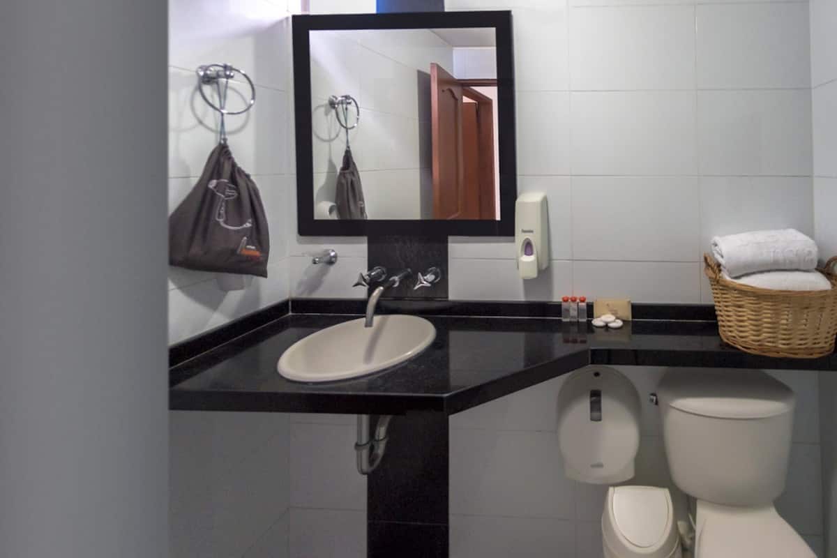 junior studio suite | bathroom | shower, free toiletries, hair dryer, towels