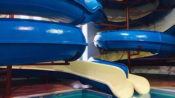 A swimming pool with multiple water slides.